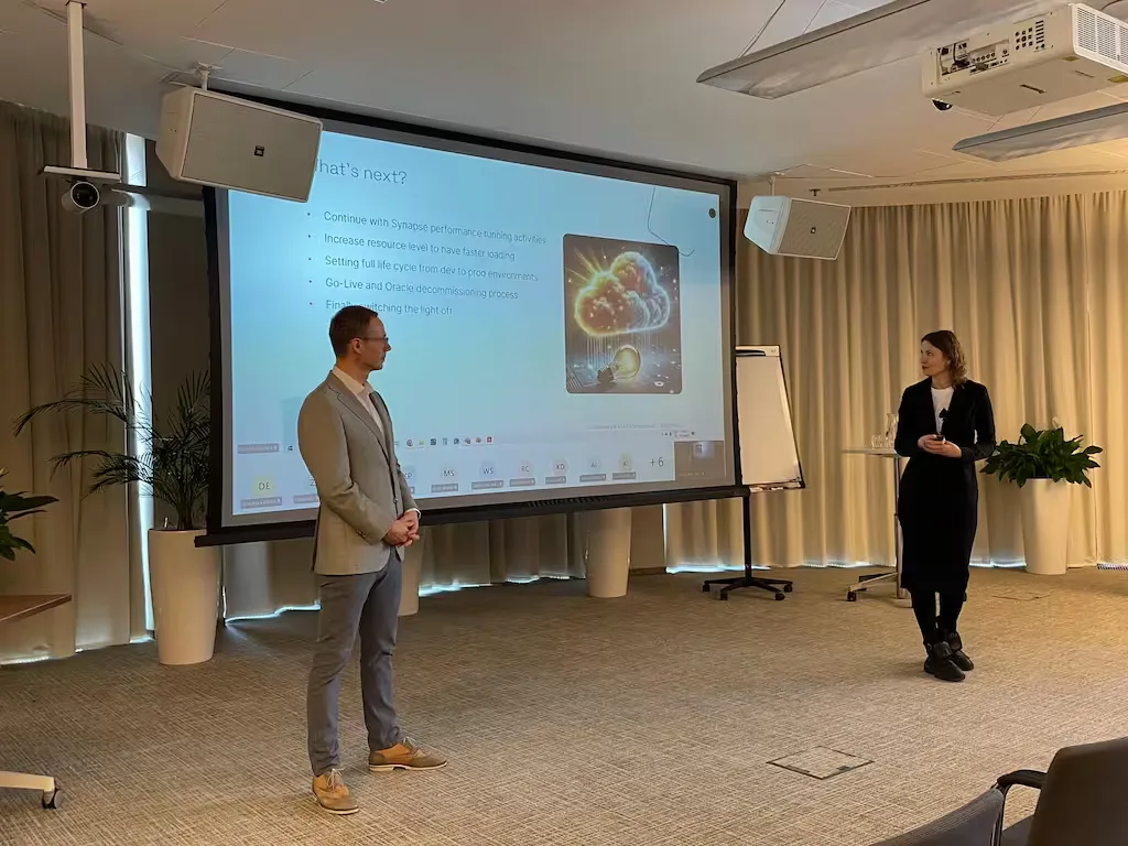 Attendees watching presentation